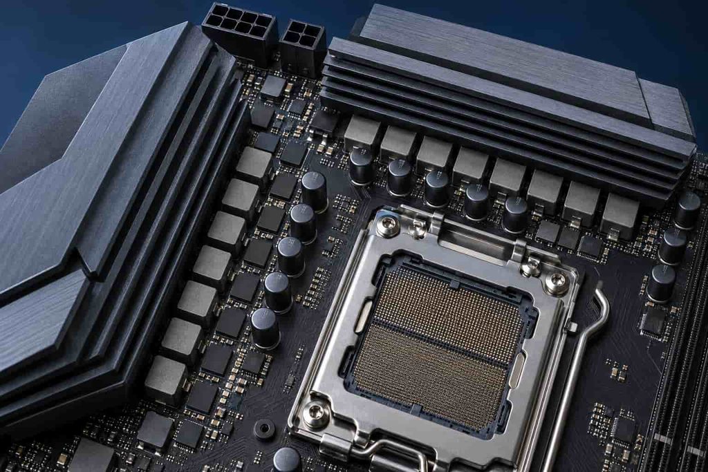 Close-up of AM5 motherboard VRM heatsinks and CPU power-delivery components